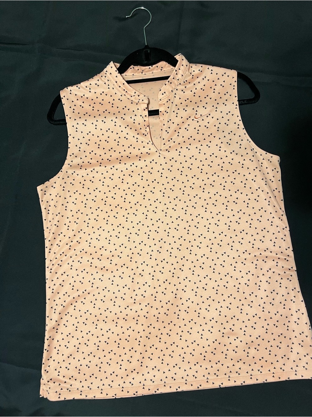 Nike Dri-FIT Sleeveless golf polo with all over Black Triangle Print pattern